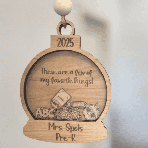 Back side of engraved hickory wood teacher ornament with message reading “Thank you for making a difference! We are blessed with you as a teacher!” signed The Shipley’s and Blue Fox logo at the bottom.