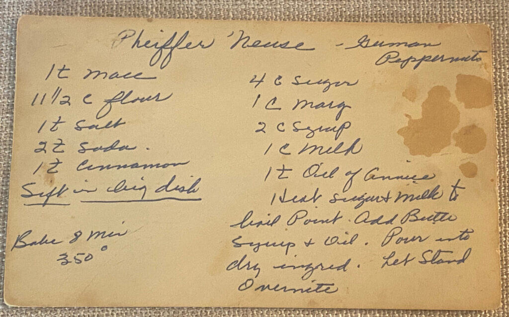 handwritten vintage peppernut cookie recipe card with aged paper stains and cursive handwriting on burlap background