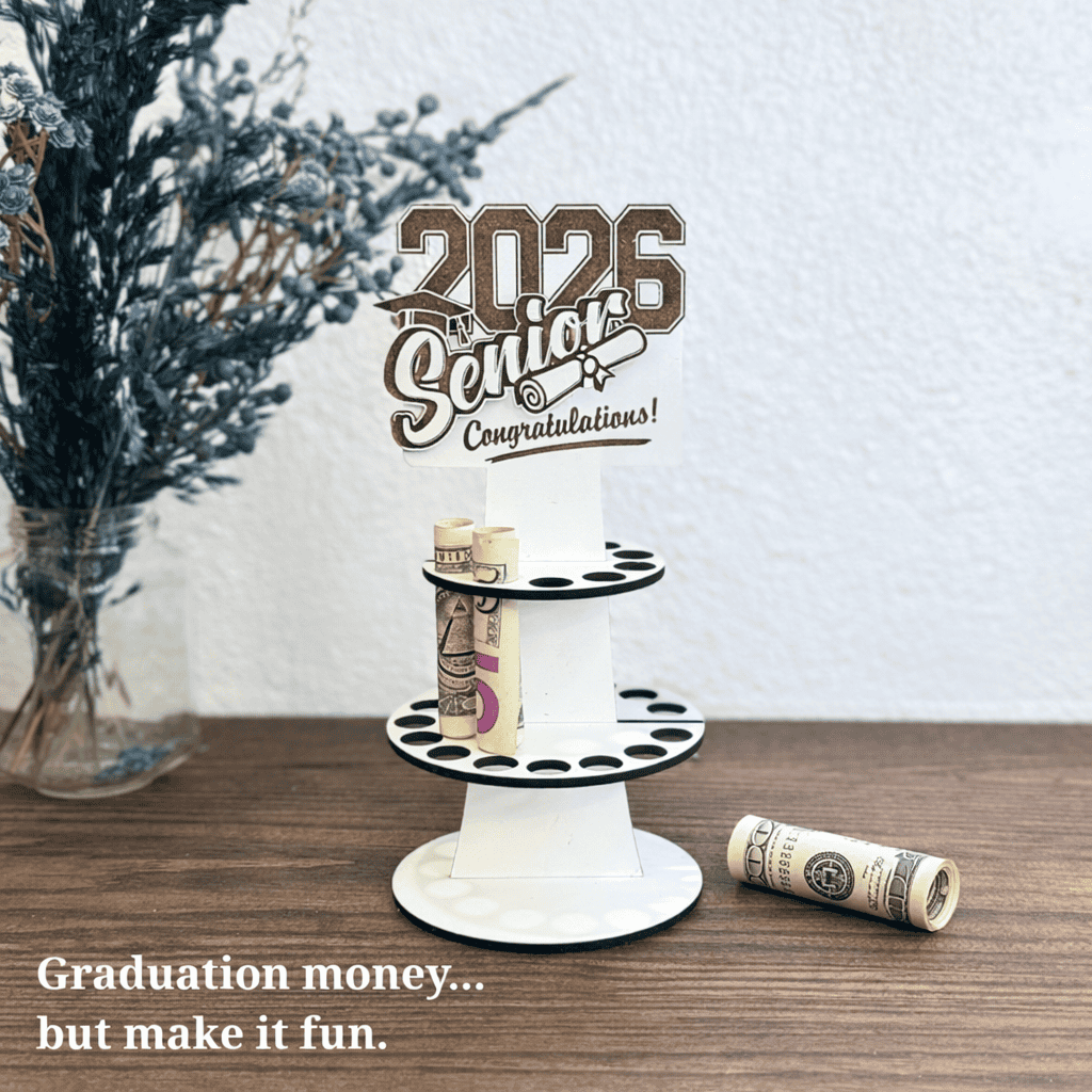 wooden class of 2026 graduation money holder with rolled dollar bills displayed on a tiered stand