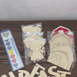 Kids DIY paint kits with wooden puppy and barn shapes including paint strip and brush